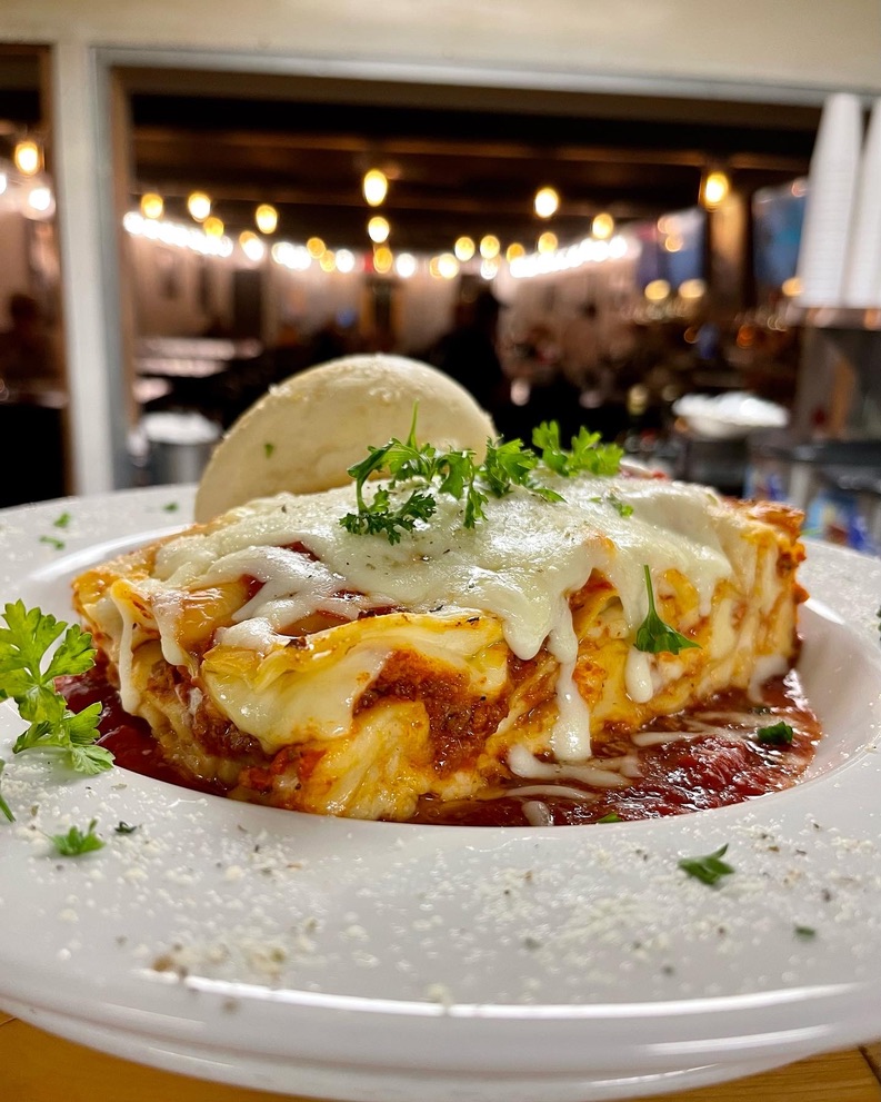 Wednesday lasagna special, dining room string lights in the background