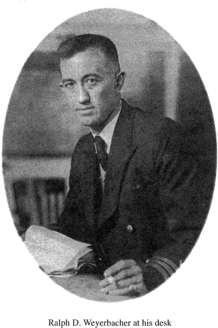 Archival black and white portrait of Ralph D. Weyerbacher at his desk